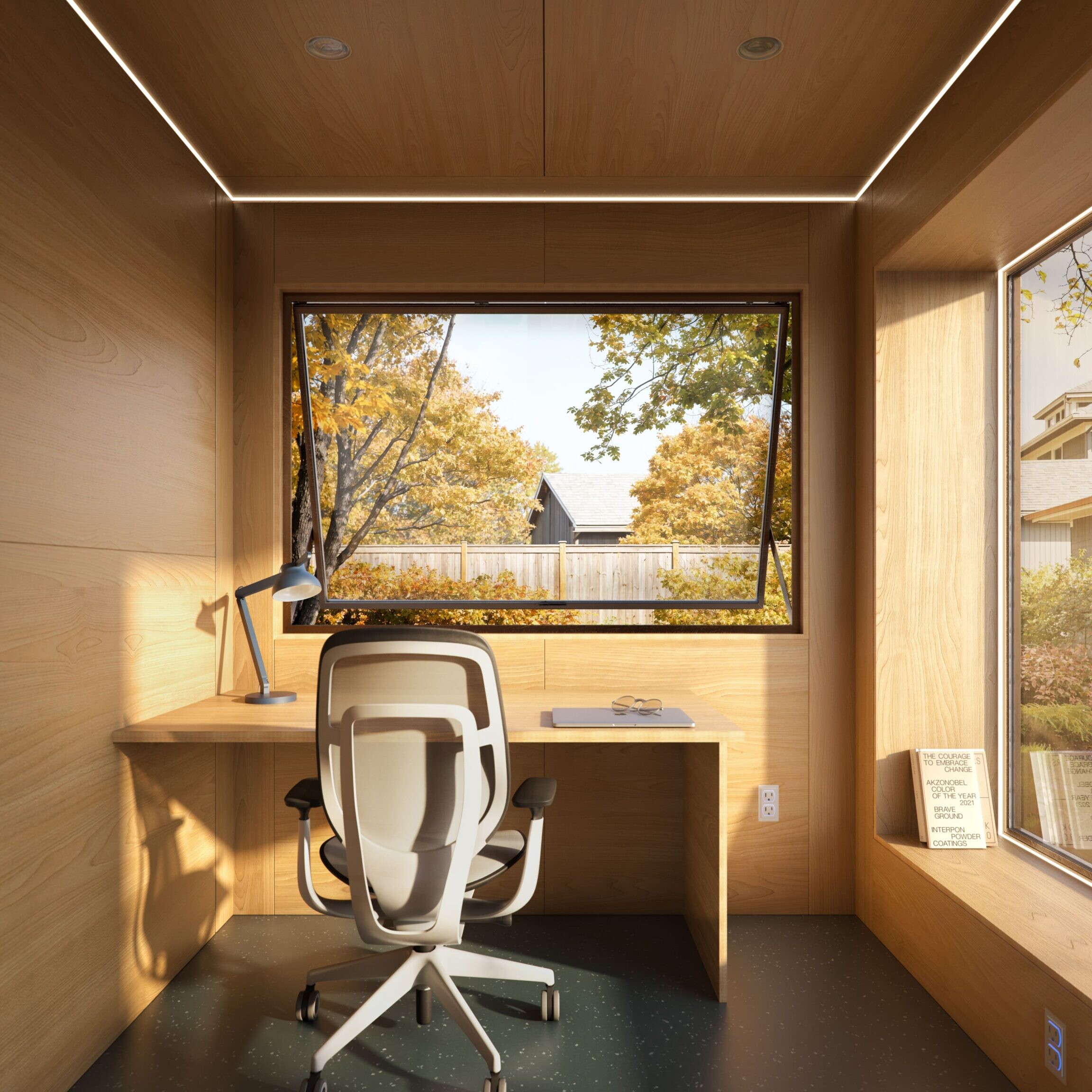 Interior of Uspace's Solo10 modern backyard office unit with birch panels, facing the awning window.