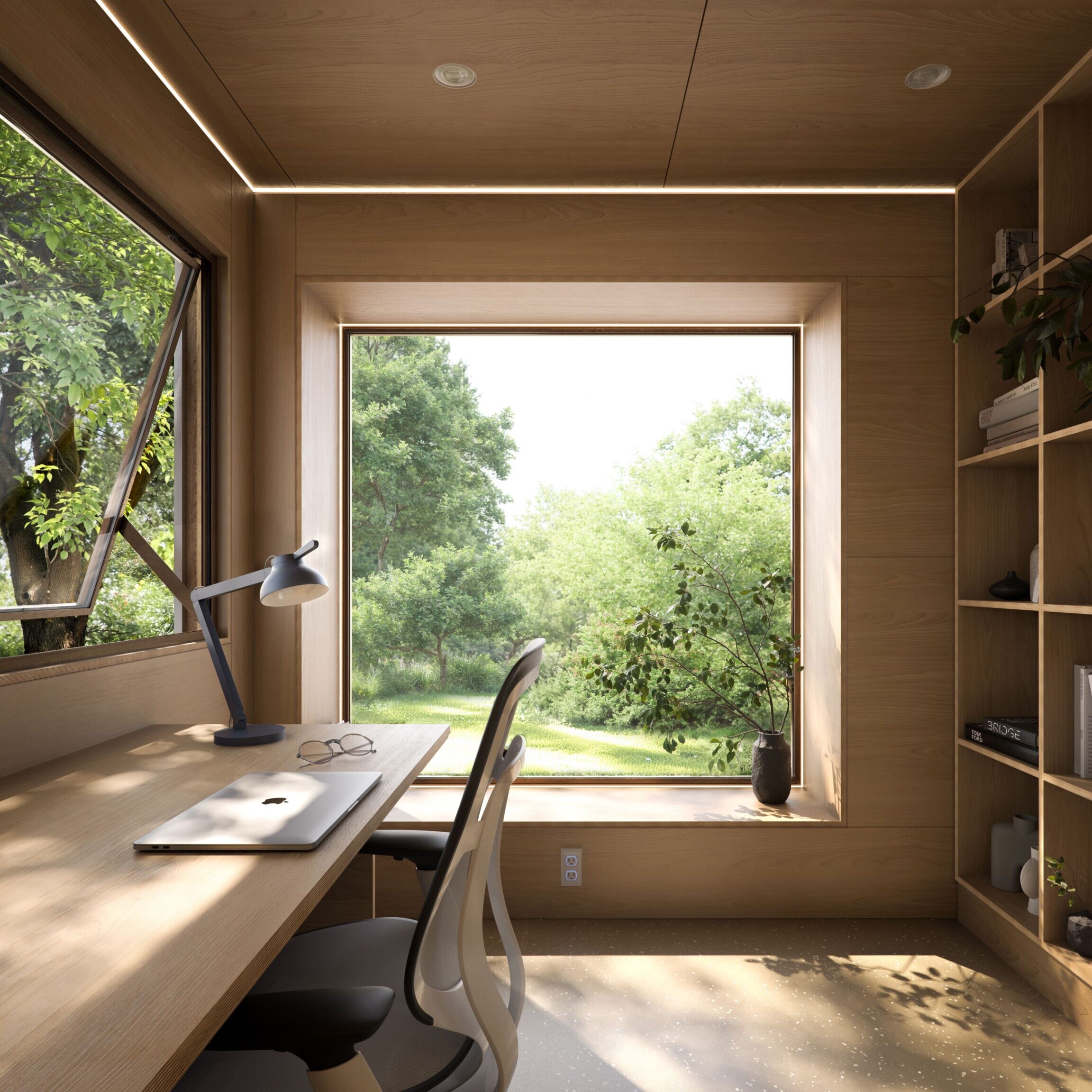 Minimalist workspace with large window overlooking lush greenery.